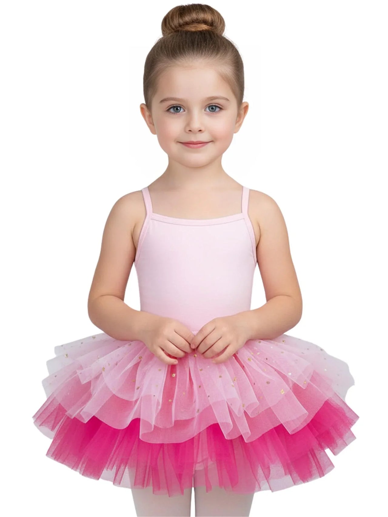 Young girl wearing a pink and white glitter ballet tutu dress with thin straps on a white background