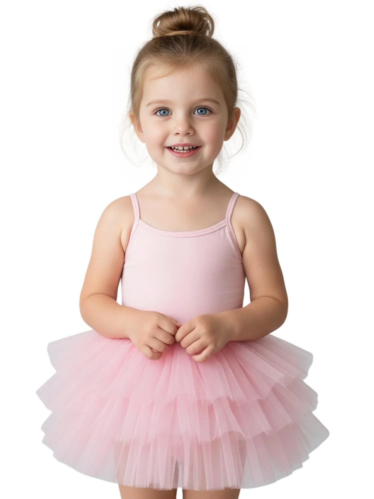 Young girl wearing a bright pink ballet tutu dress with thin straps on a white background