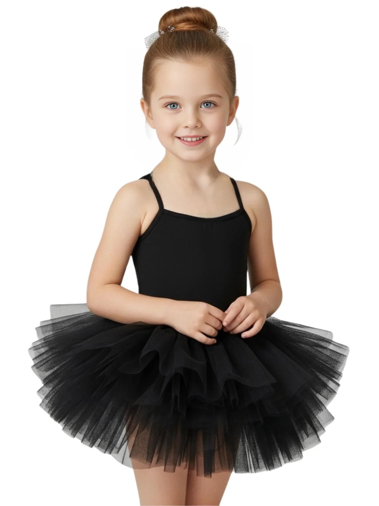 Young girl wearing a black ballet tutu dress with thin straps on a white background