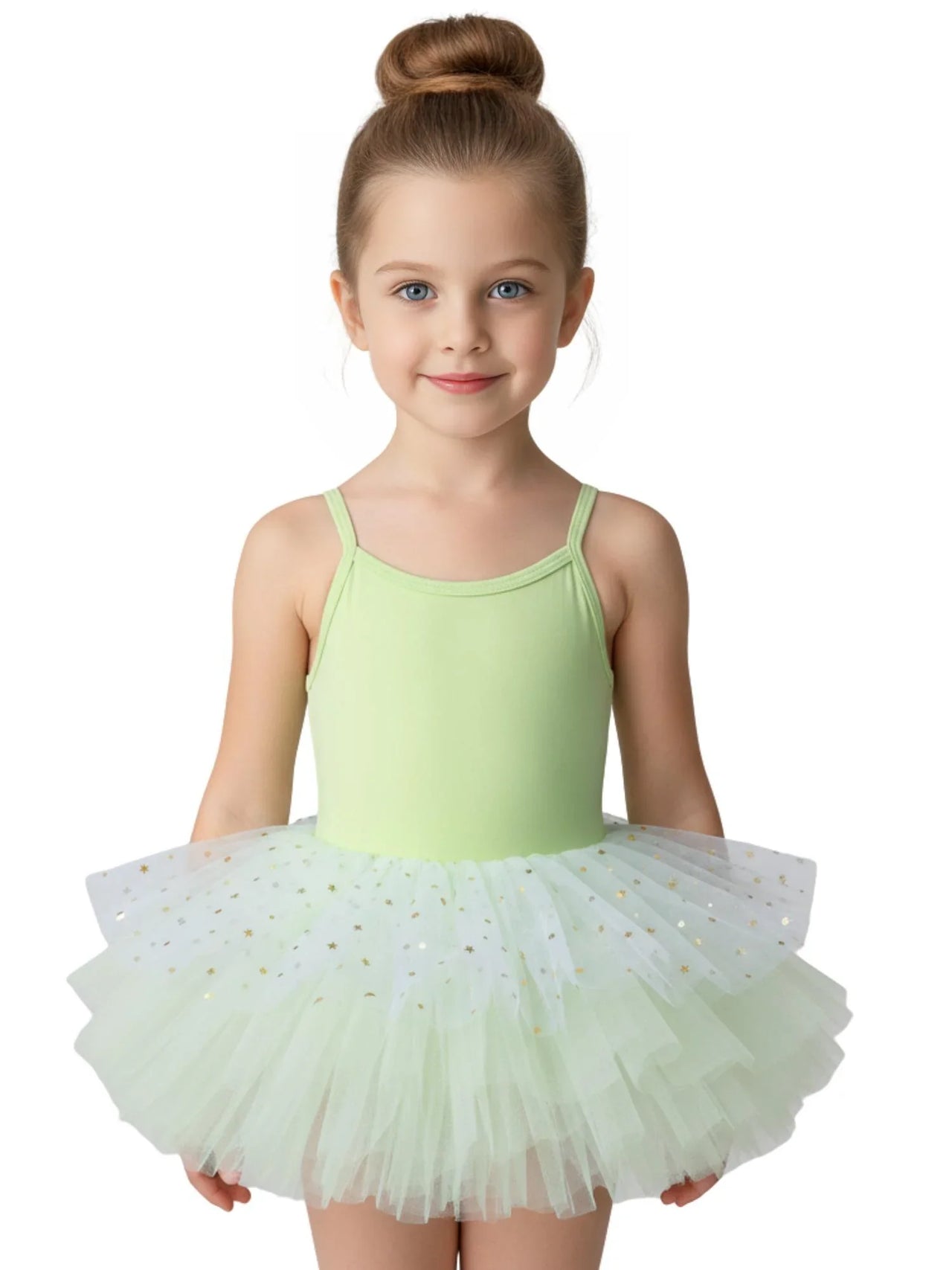 Young girl in a green glitter ballet tutu dress with thin straps on a white background