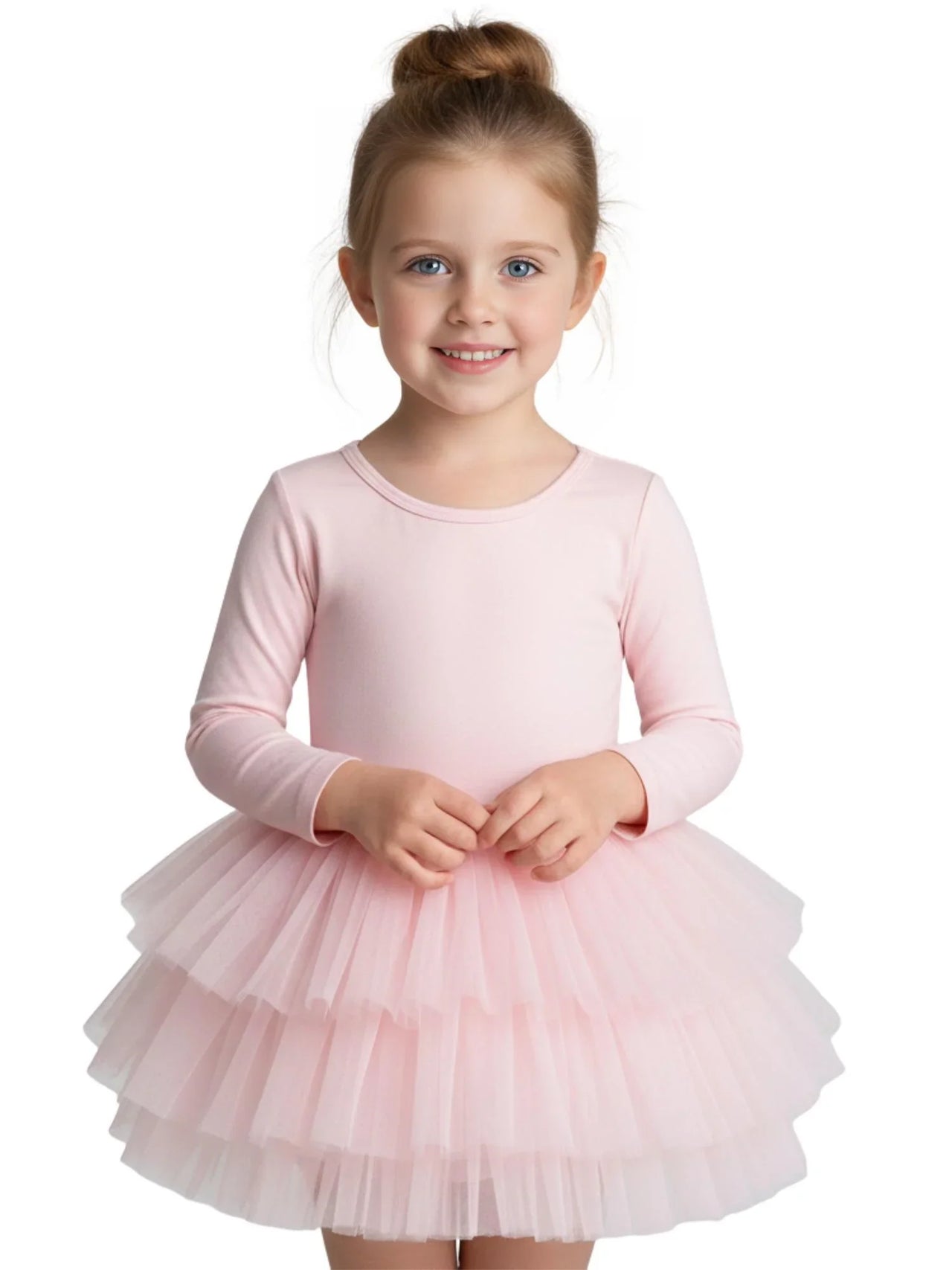 Young girl wearing a pink long sleeved ballet tutu dress on a white background