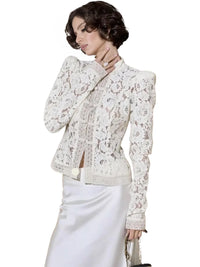 Thumbnail for Woman wearing a white lace blouse on a white background