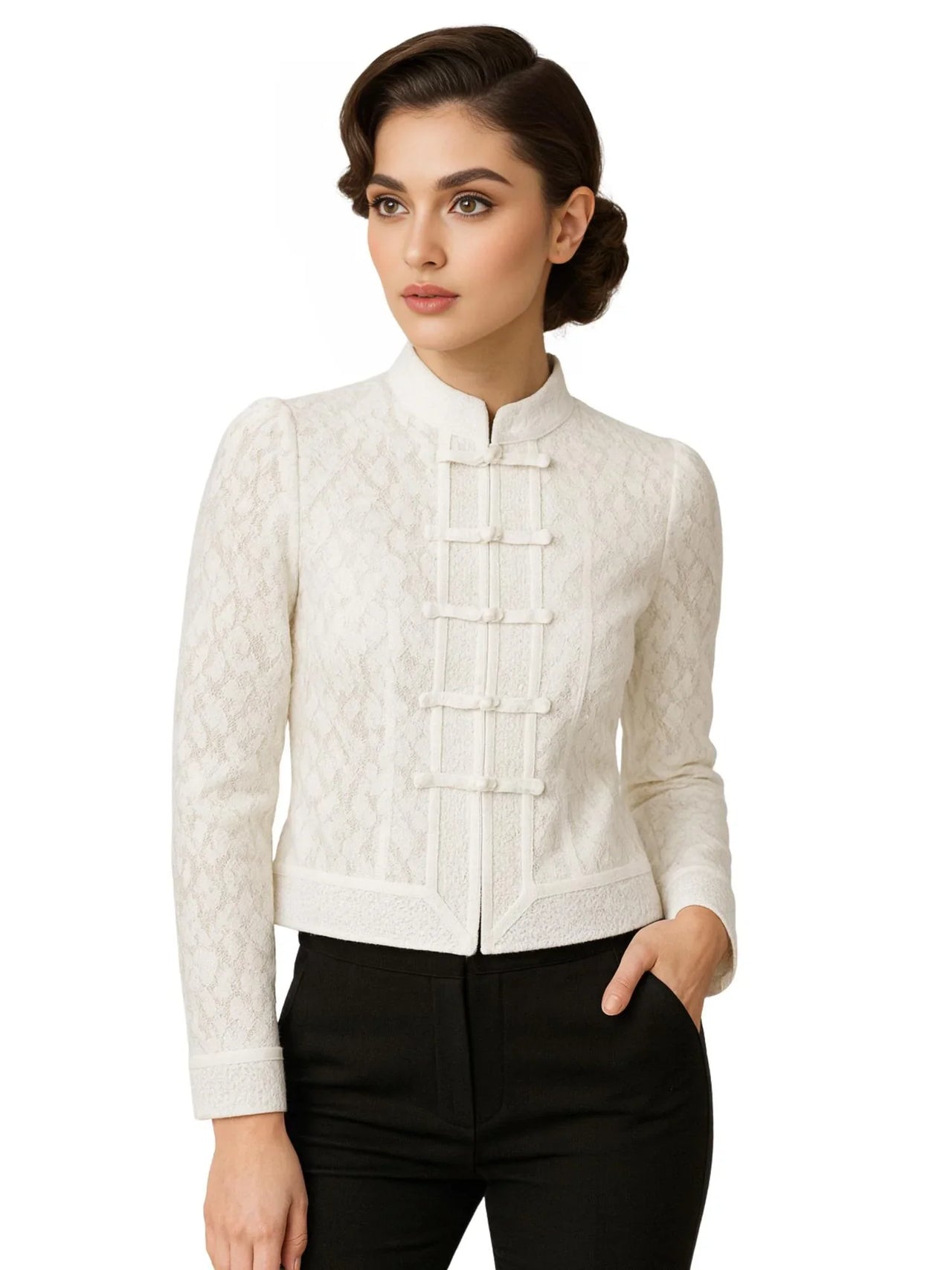Woman wearing a white lace blouse with black pants on a white background
