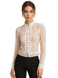 Thumbnail for Woman wearing a beige lace blouse with a white collar on a white background