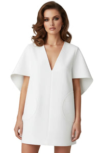 Thumbnail for Woman wearing a white mini dress with cape sleeves on a white background