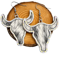 Thumbnail for Longhorn steer earrings with rhinestone accents on a wooden background