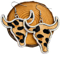 Thumbnail for Leopard print longhorn cow earrings on a wooden background