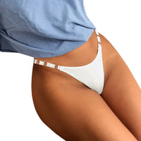 Thumbnail for Person wearing a blue shirt and white thong panties on a white background