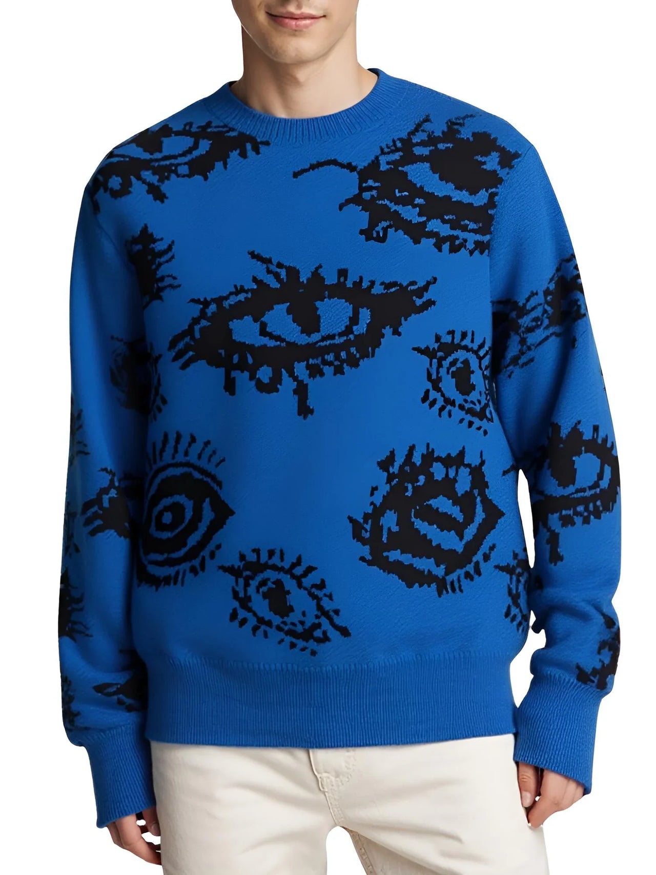 Blue sweater with black eye patterns worn by a person on a white background