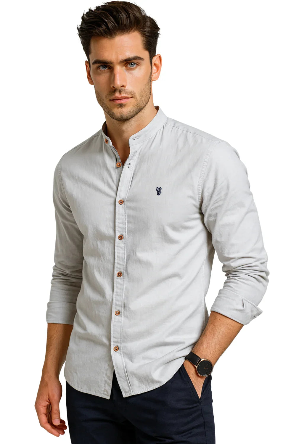 Man wearing a light gray button-up shirt with a white background