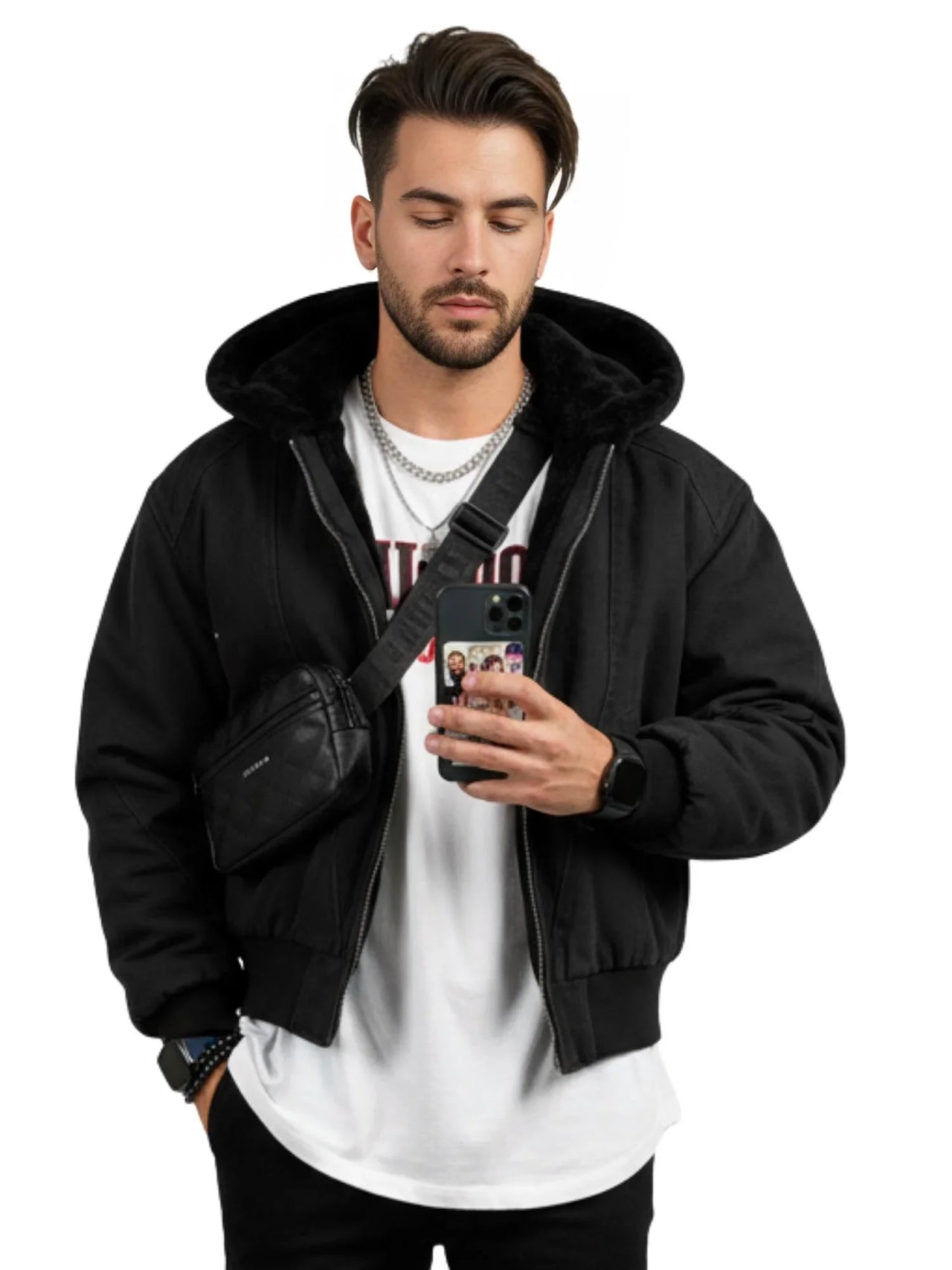 Man wearing a black hooded canvas short jacket with a white shirt underneath, holding a phone with a white background