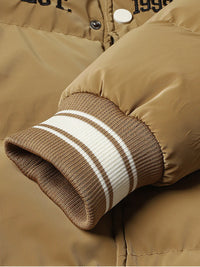 Thumbnail for Close-up of a brown jacket with striped cuffs