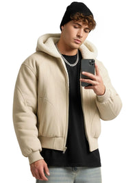 Thumbnail for Man wearing a khaki hooded canvas short jacket holding a phone on a white background