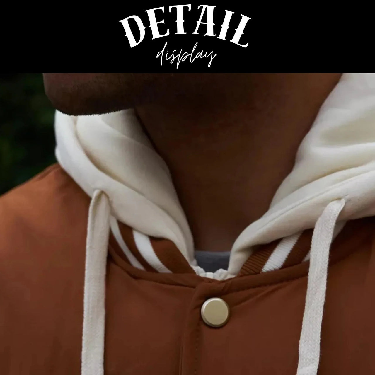 Close-up of a brown jacket with white hood and gold button, text 'DETAIL display' at the top.