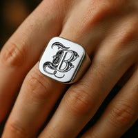 Thumbnail for Silver ring with the initial 'b' on a hand