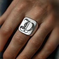 Thumbnail for Silver ring with the initial 'd' on a hand