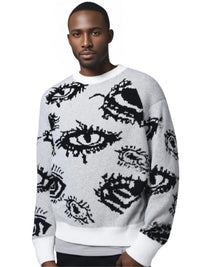 Thumbnail for Man wearing a white sweater with black eye designs on a white background