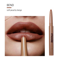 Thumbnail for Lipstick being applied to lips with 'rhode' brand visible, labeled 'Bend' soft peachy beige.
