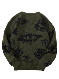 Thumbnail for Green sweater with black eye pattern on a white background