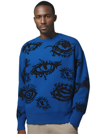 Thumbnail for Man wearing a blue sweater with black eye patterns on a white background