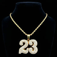 Thumbnail for Gold necklace with a '23' pendant on a black background
