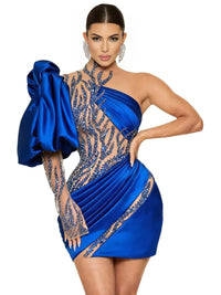 Thumbnail for Woman wearing a blue mini dress with crystals on a white background