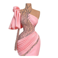Thumbnail for Pink evening gown with embellishments on a mannequin against a white background