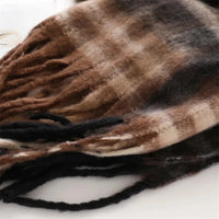 Thumbnail for Brown and black plaid blanket with fringes on a white background