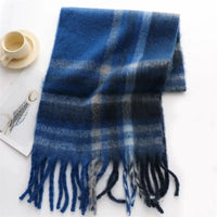Thumbnail for Blue plaid scarf with fringes on a white surface