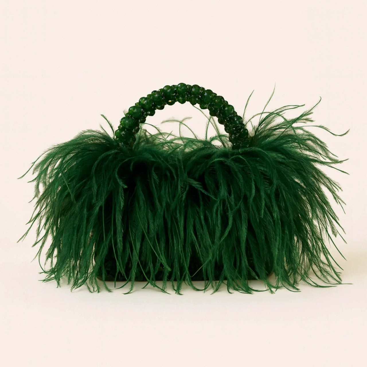 Dark green ostrich feather handbag with beaded handle on a white background
