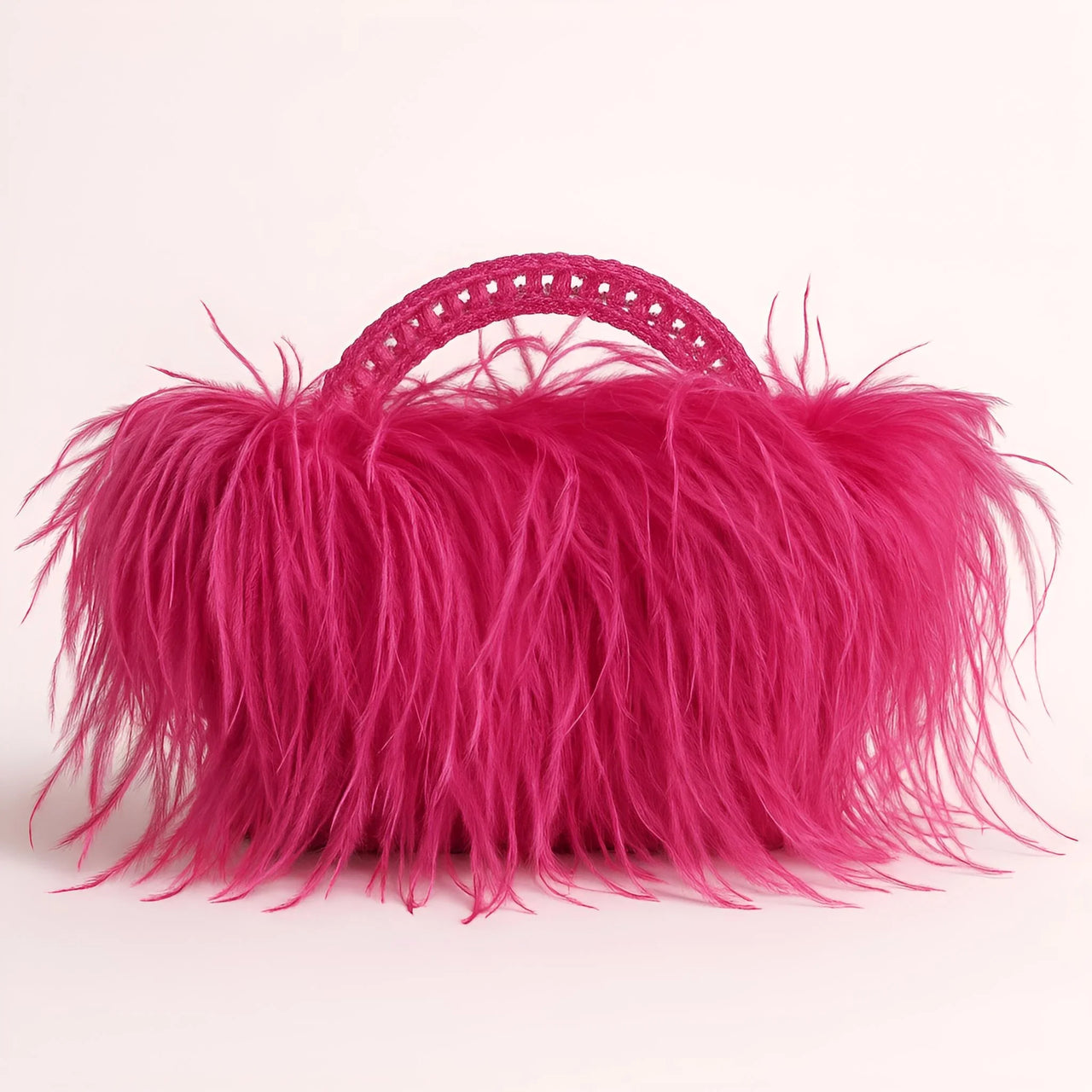 Pink ostrich feather handbag on a light pink background