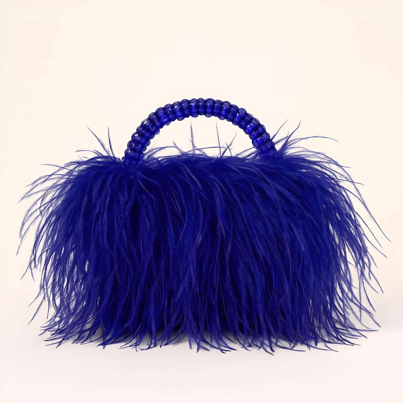 Blue ostrich feather handbag with beaded handle on a white background