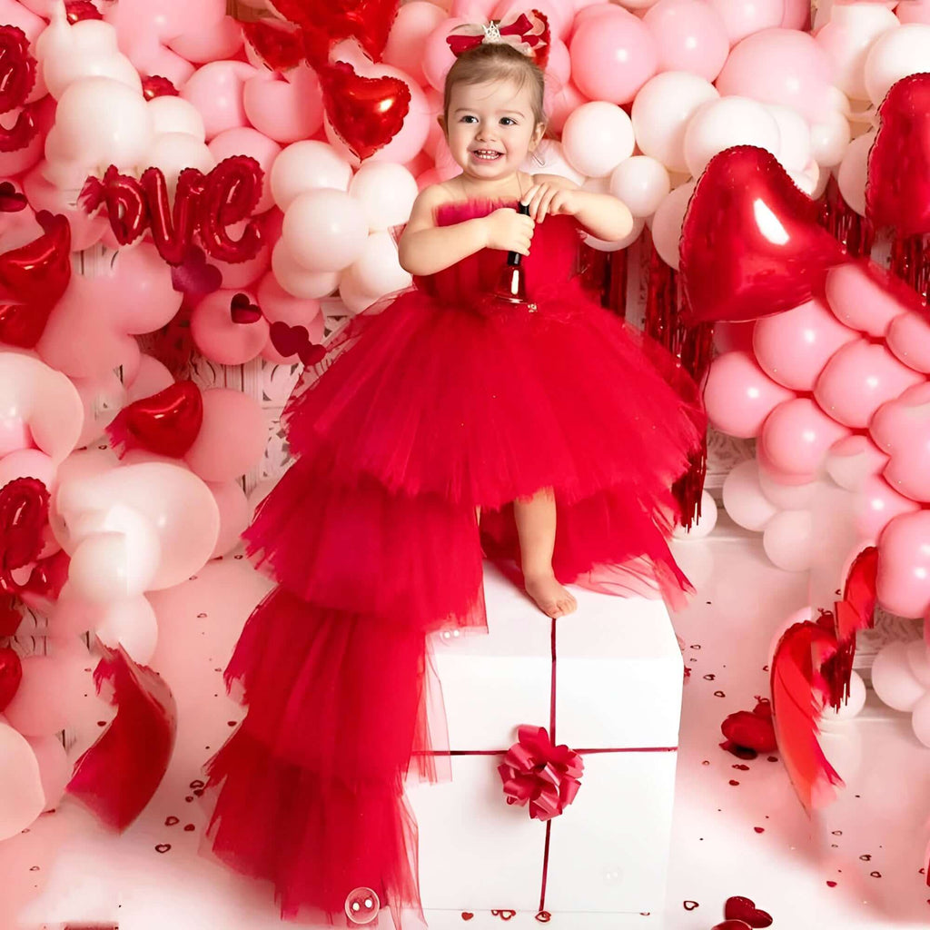 Shop the exquisite Puffy Tulle Girls Red Dress at Drestiny! Perfect for First Communion parties, this trailing dress is a must-have. Enjoy free shipping and let us cover the tax! Save up to 50% off!