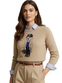 Thumbnail for Woman wearing a khaki pullover sweater with a teddy bear design on a white background