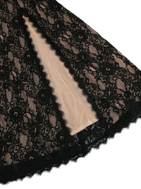 Thumbnail for Black lace fabric with a beige lining on a white background