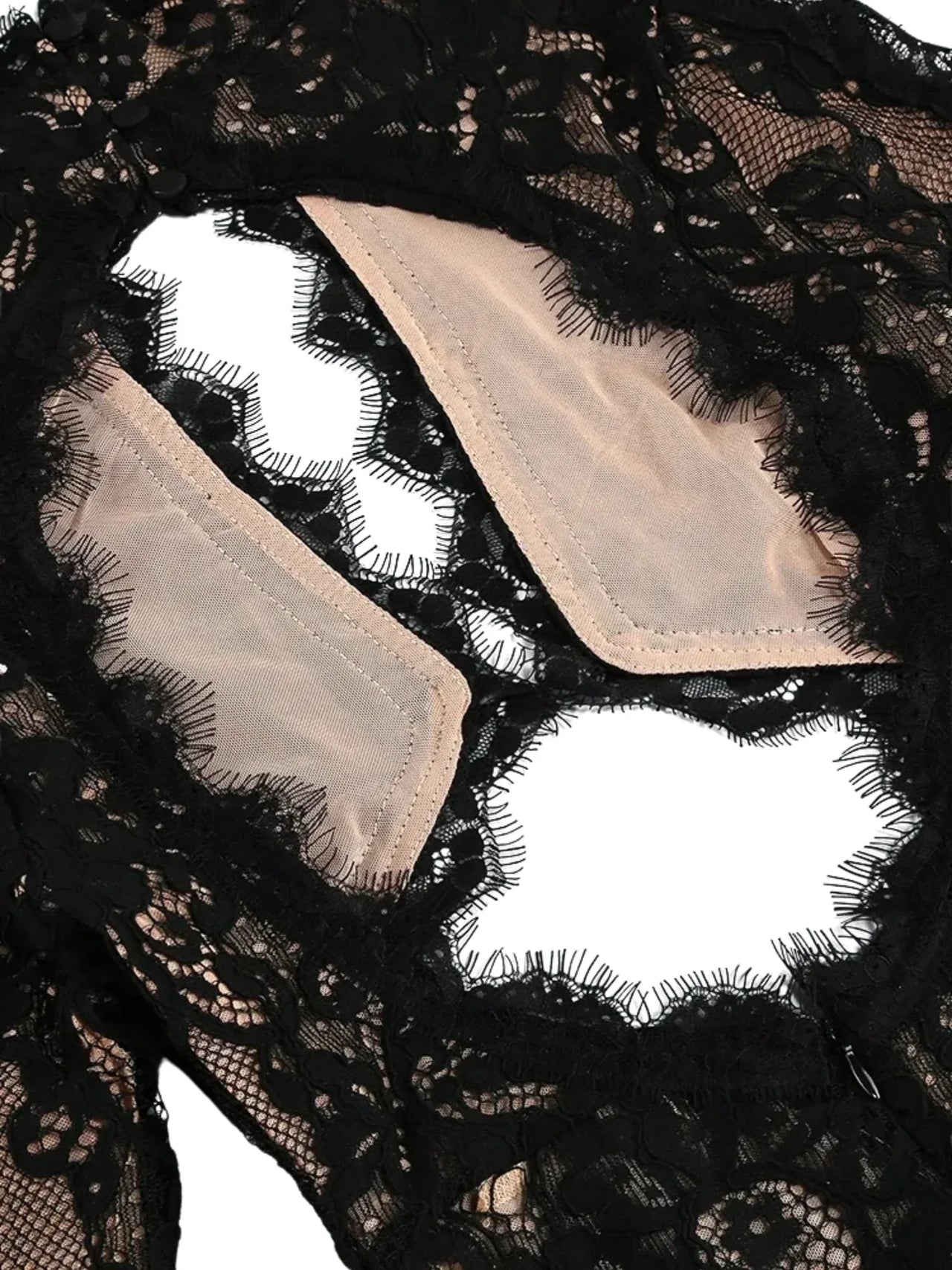 Black lace fabric with beige lining on a white background