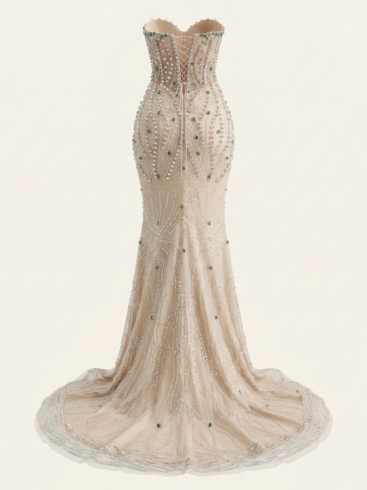 Champagne strapless mermaid evening gown with intricate beadwork on a white background
