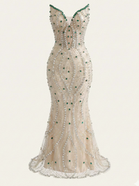 Thumbnail for Elegant strapless evening gown with intricate beading and green gem stones on a white background