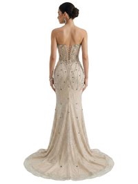Thumbnail for Woman wearing a strapless, beaded mermaid evening gown on a white background