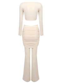 Thumbnail for Woman's sheer 2 piece beige pant set with a hollow out crop top on a white background