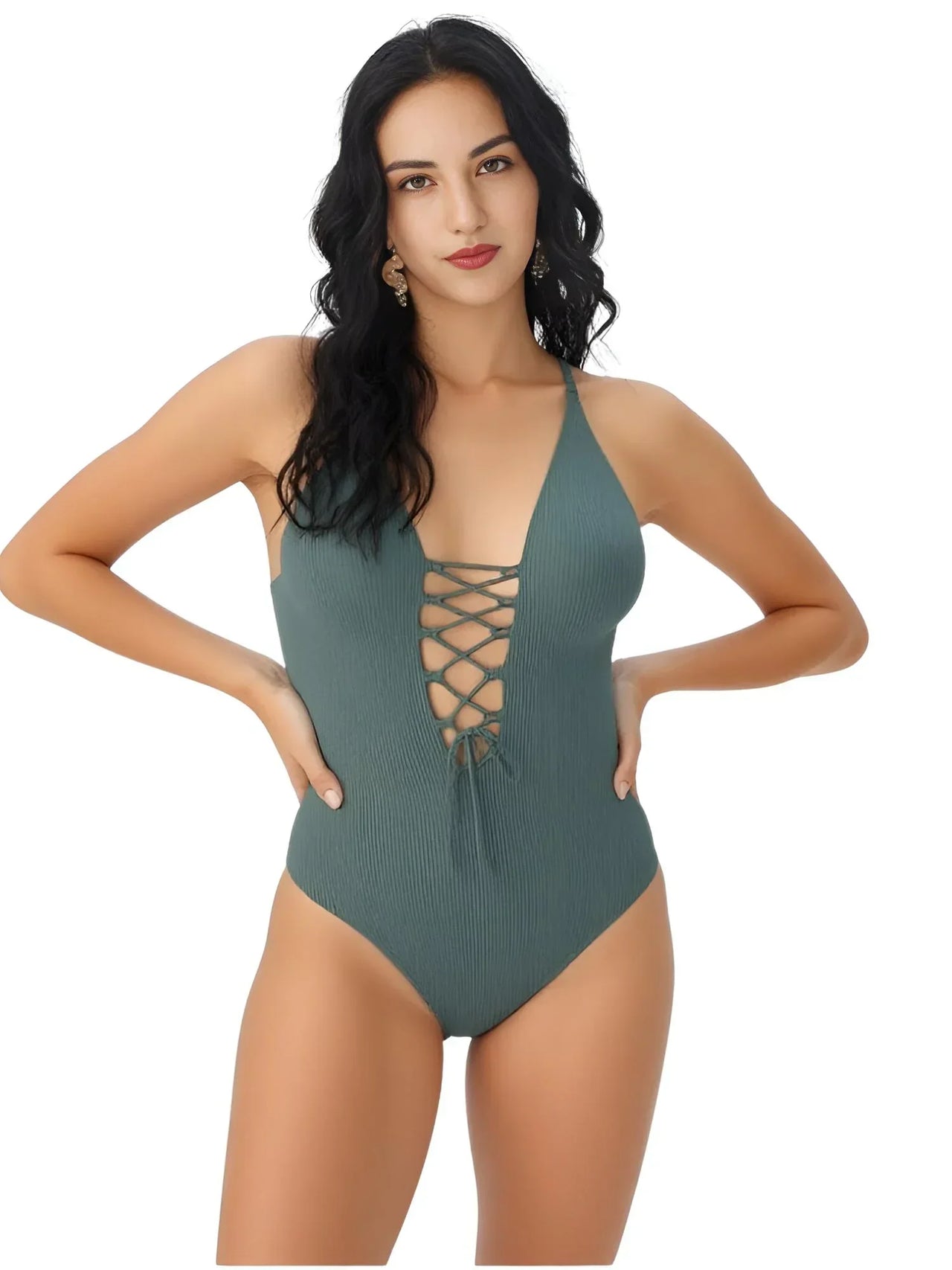 Woman wearing a green swimsuit with a white background