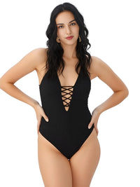 Thumbnail for Woman wearing a black swimsuit with a plunging neckline and lace-up details on a white background