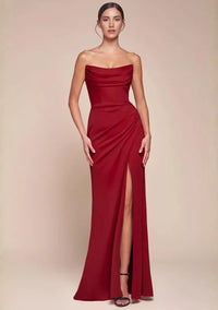 Thumbnail for Red strapless evening gown with a high split on a beige background