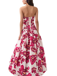 Thumbnail for Woman wearing a red floral strapless long bubble dress on a white background