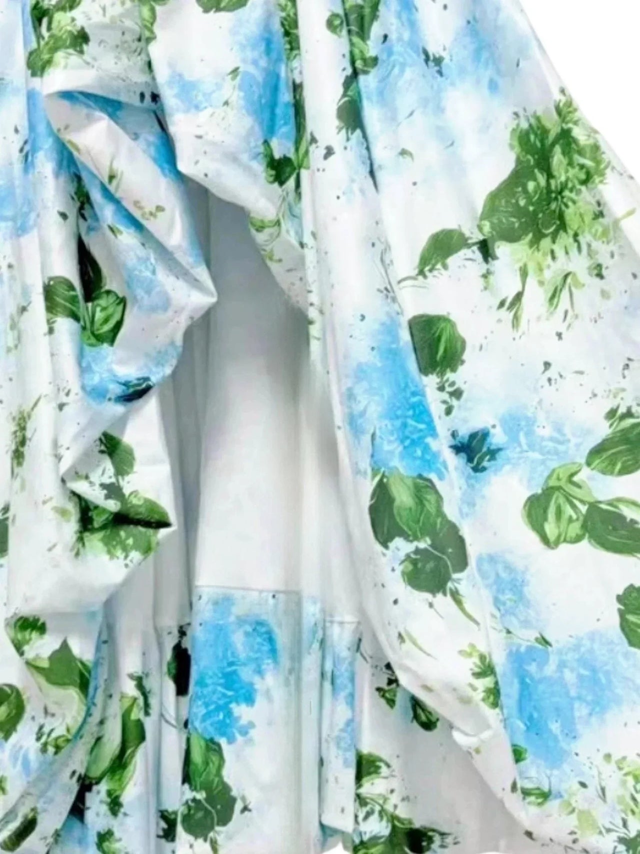 Fabric with blue and green leaf pattern on a white background