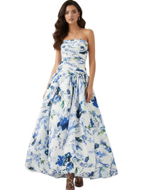Thumbnail for Woman wearing a floral strapless long bubble dress with blue and white flowers on a white background