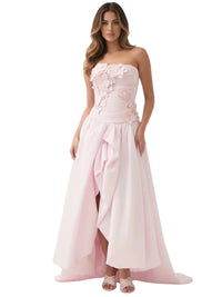 Thumbnail for Woman wearing a pink long bubble dress with a high slit on a white background