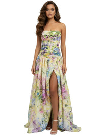 Thumbnail for Woman wearing a floral strapless long bubble dress with a high slit on a white background