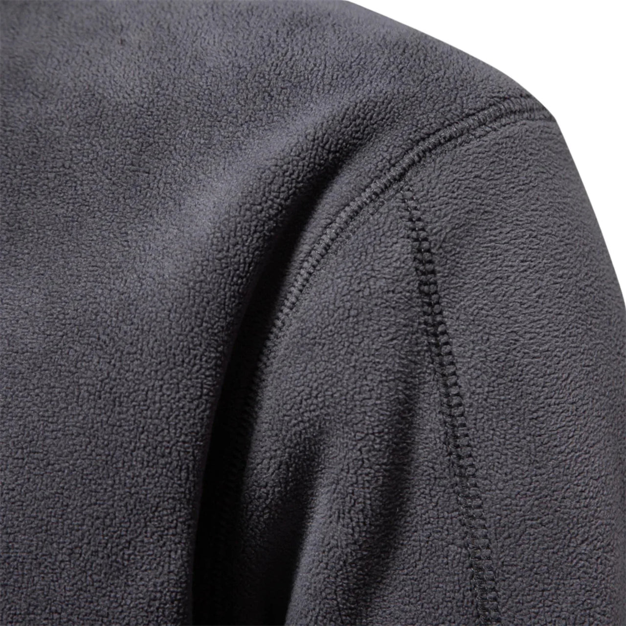 Close-up of a textured gray fleece fabric with stitching detail.