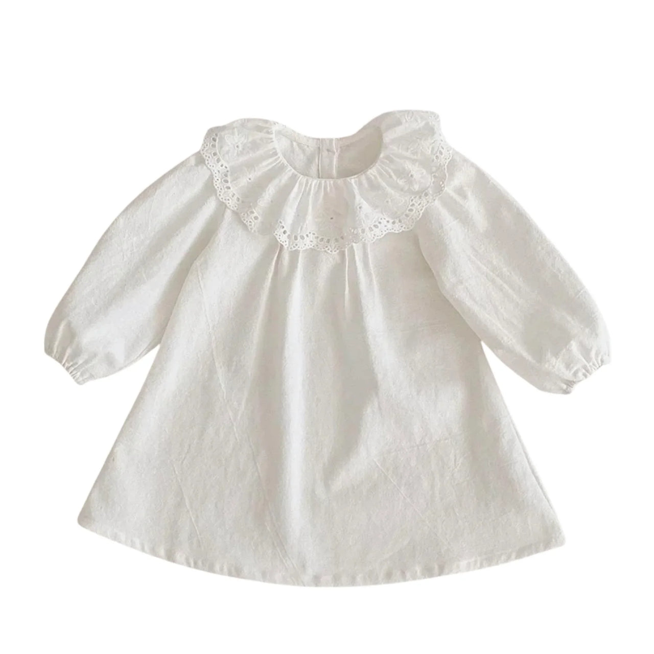 White baby dress with lace details on a white background